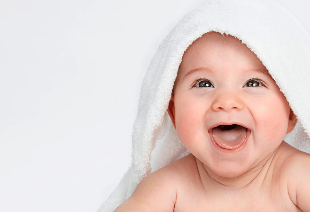 Smiling baby with healthy skin